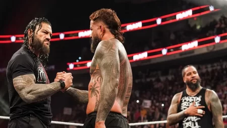 Roman Reigns shakes hands with Jey Uso